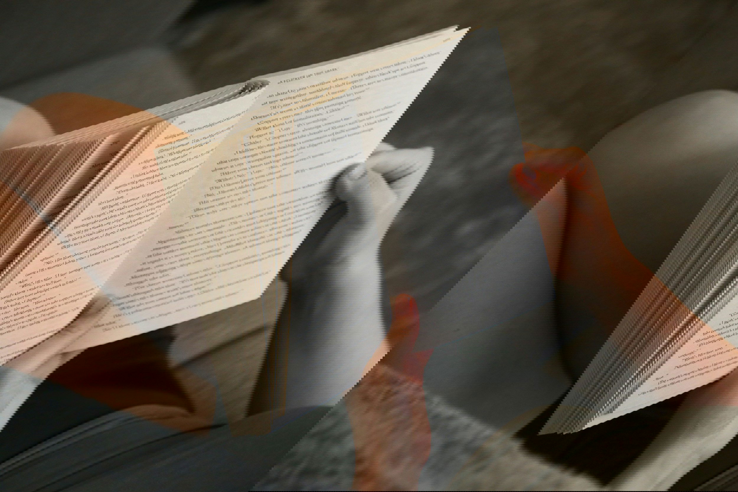 A woman is reading a book