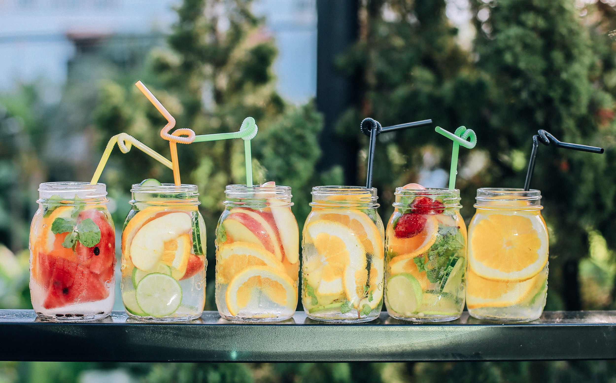 Cups full of fun and decorated lemonade outside in the summer