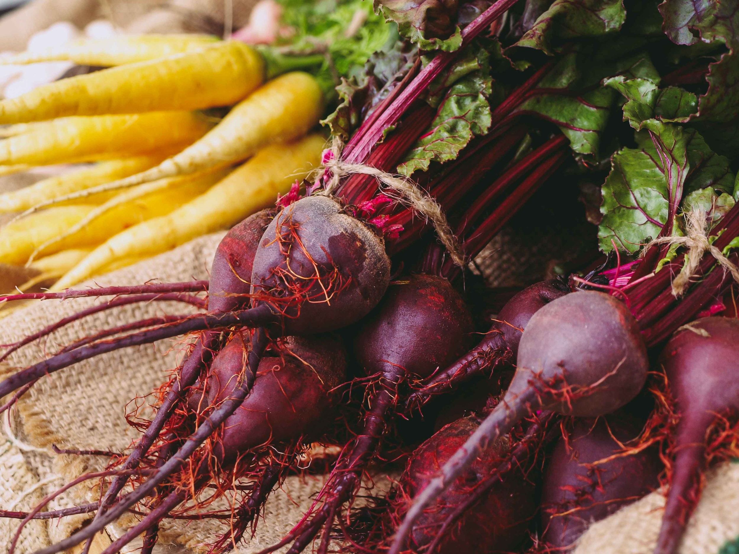 A bundle of yellow carrots and beets