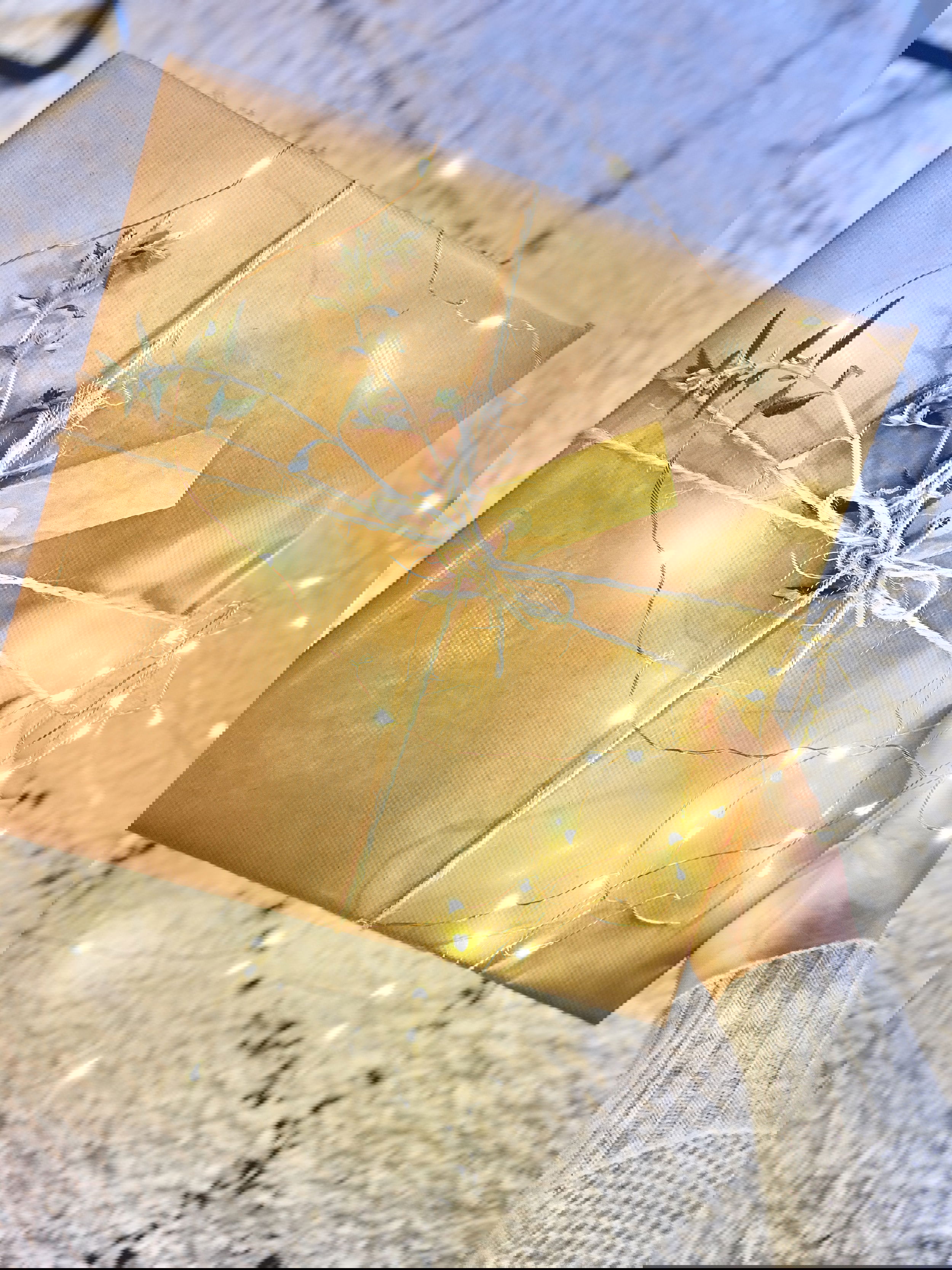 A book in gold gift wrap beautifully presented