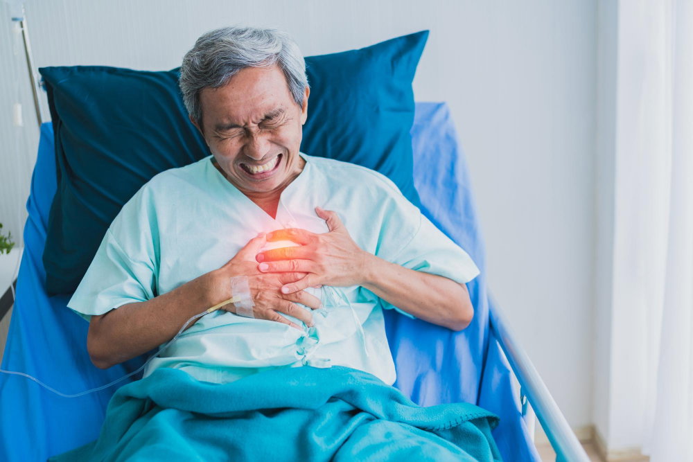 An adult patient lying in a hospital bed, appearing to experience severe chest pain or discomfort 