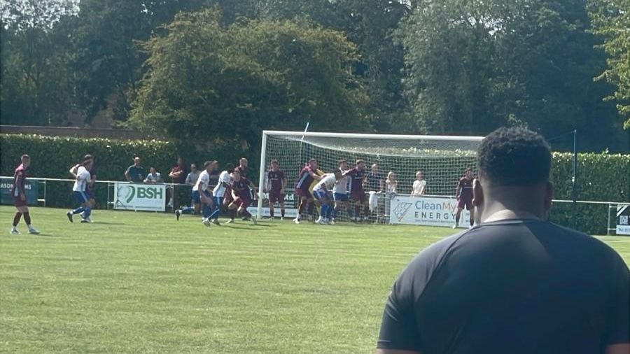 Coach Gavin keeps a close eye on the build up to the goal.