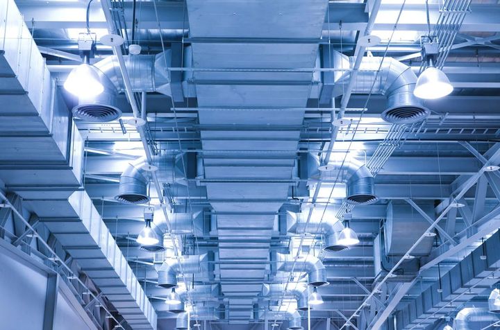 Industrial refrigeration system with complex piping, gauges, and machinery, showcasing Cold Logic’s expertise in Industrial Refrigeration Melbourne for temperature-controlled storage and processing facilities.