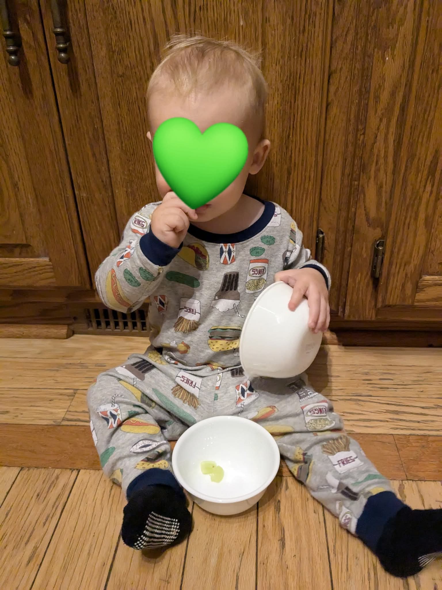 A toddler is shown eating snacks from Corelle snack size bowls