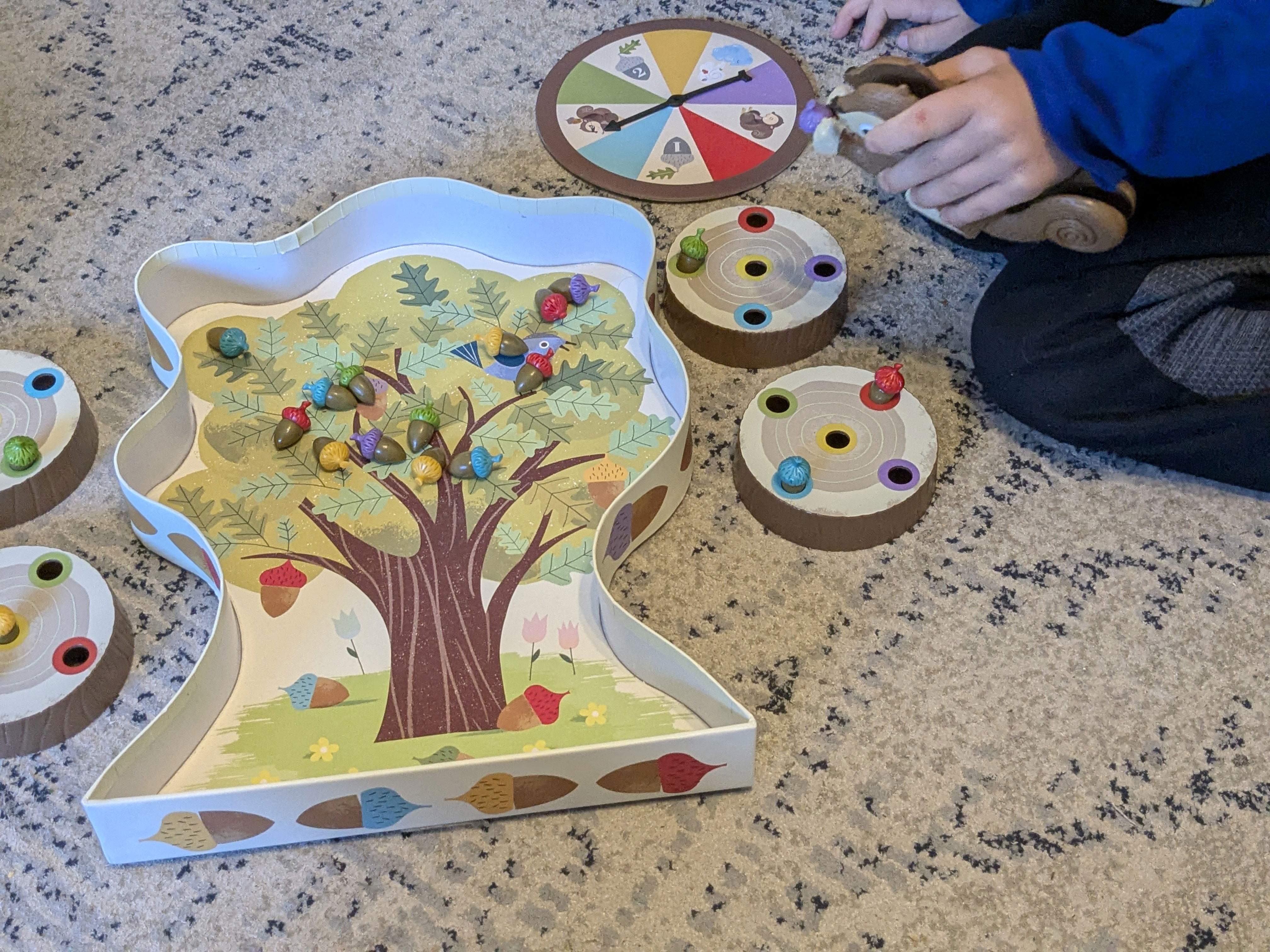 A young boy playing a game and using his fine motor skills 