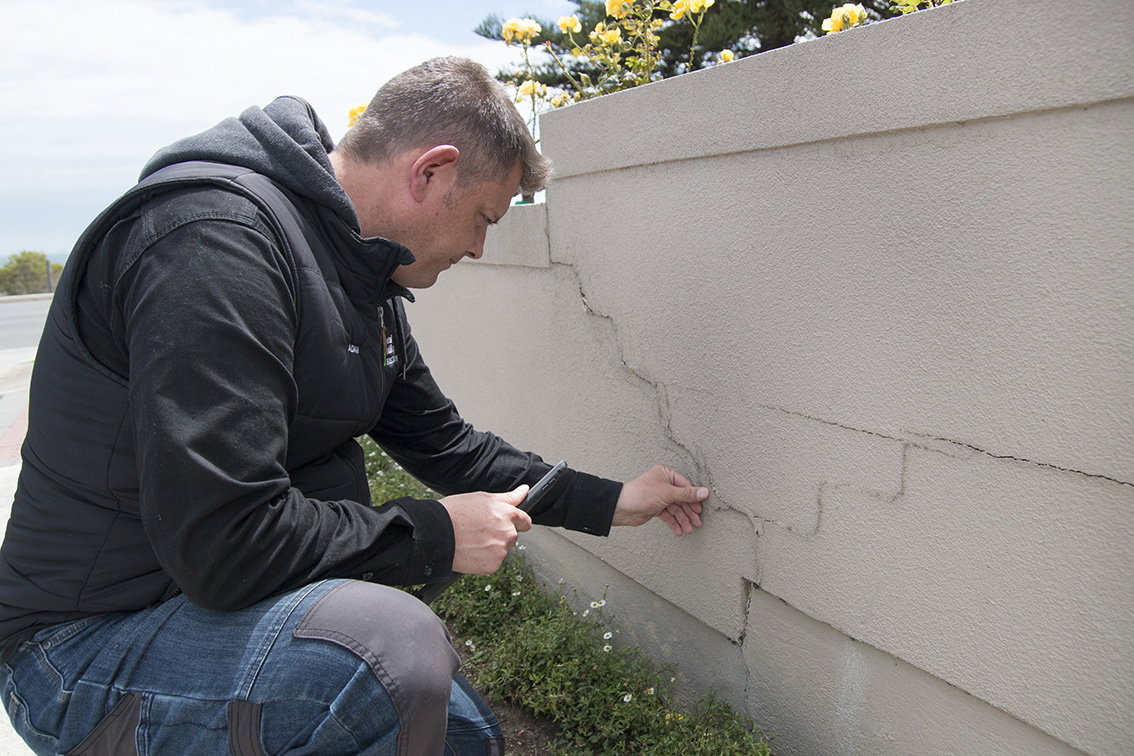 A professional building inspector Adelaide assessing a home for structural issues during a building inspection Adelaide, ensuring safety and compliance. Includes pest inspections Adelaide for property buyers.