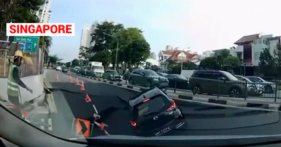 Una voragine si apre nell’asfalto e inghiotte un’auto a Singapore: salva la conducente