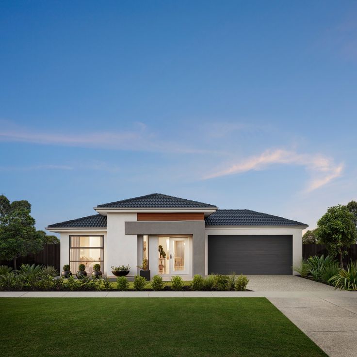 Modern single-story home with landscaped yard and garage, showcasing premium real estate in Bleinhem.