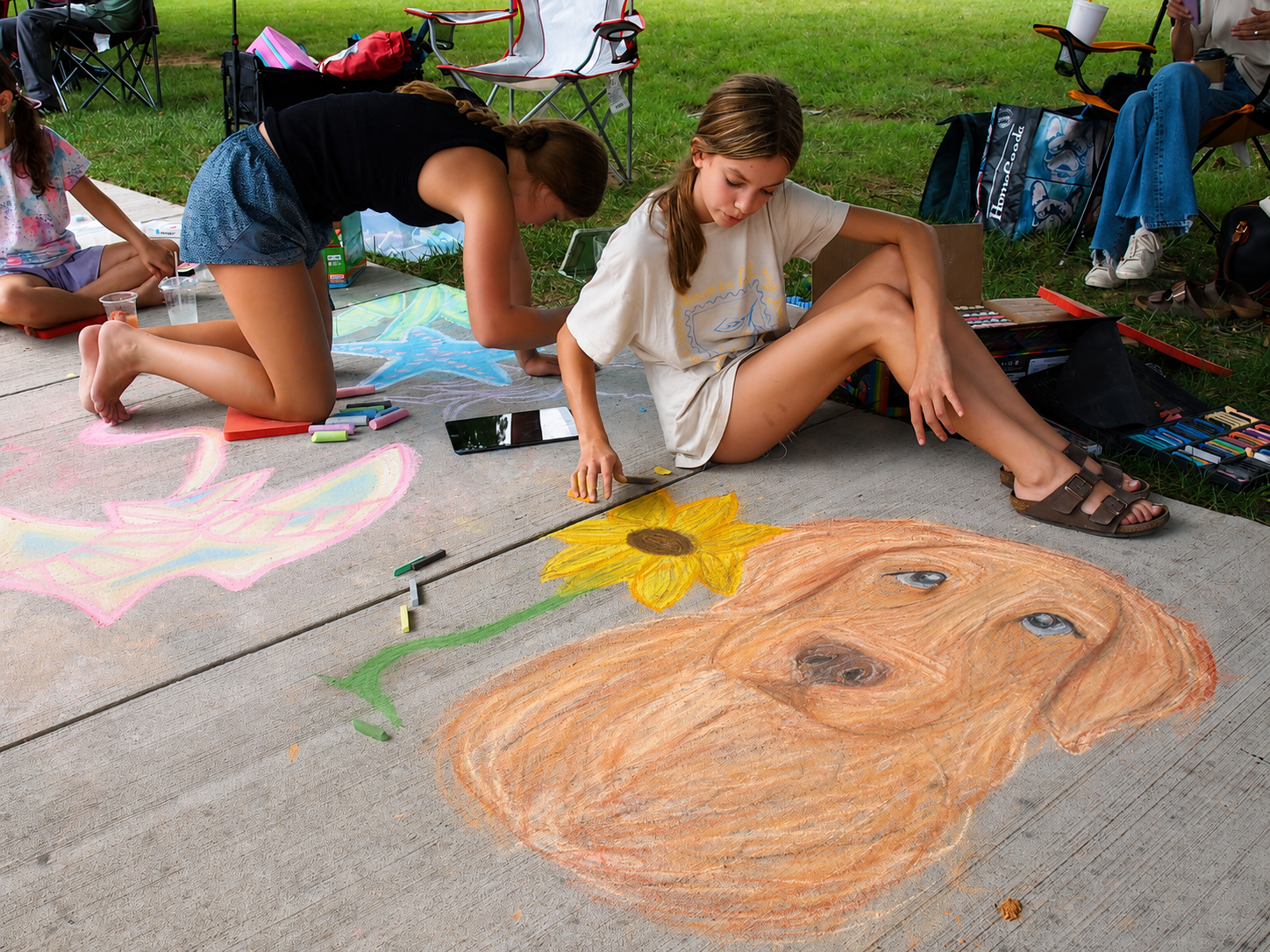 Kingsport Fun Fest: A young girl creates an image of her dog for the Chalk Walk competition during the Downtown Street Fair, Kingsport, TN, July 18, 2026 [Photo: S Cobaugh]