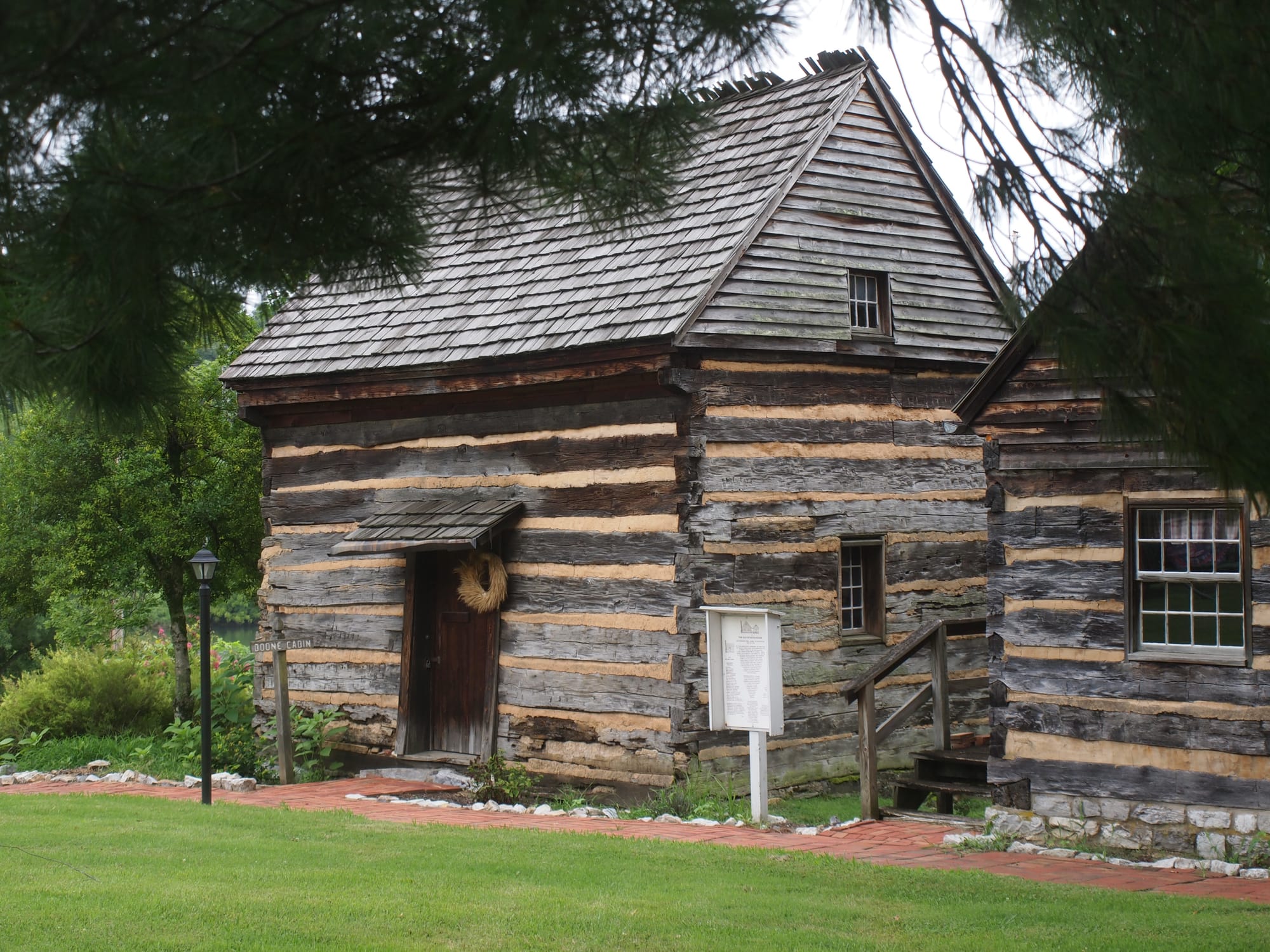 Kingsport Fun Fest: Famous wilderness explorer Daniel Boone began the Boone Trace (Wilderness Road) from near here in 1775. His original 1773-1775 cabin was relocated from Duffield, VA, to this site on the Netherland Inn property, Kingsport, TN, July 18, 2026 [Photo: S Cobaugh]
