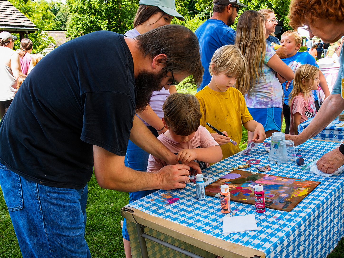 Kingsport Fun Fest: A father helps his child with a craft during Farm Fest at the Exchange Place Living History Farm, Kingsport, TN, July 19, 2026 [Photo: J Lowry]