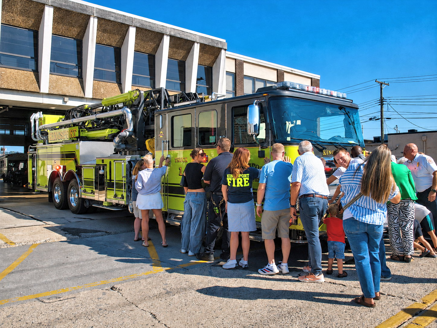 In a time-honored tradition that dates back to horse-drawn fire service carriages, the public joined firefighters in pushing Truck 1 into its bay at Station 1 in downtown Kingsport, TN, August 4, 2026 [Photo: S Cobaugh]