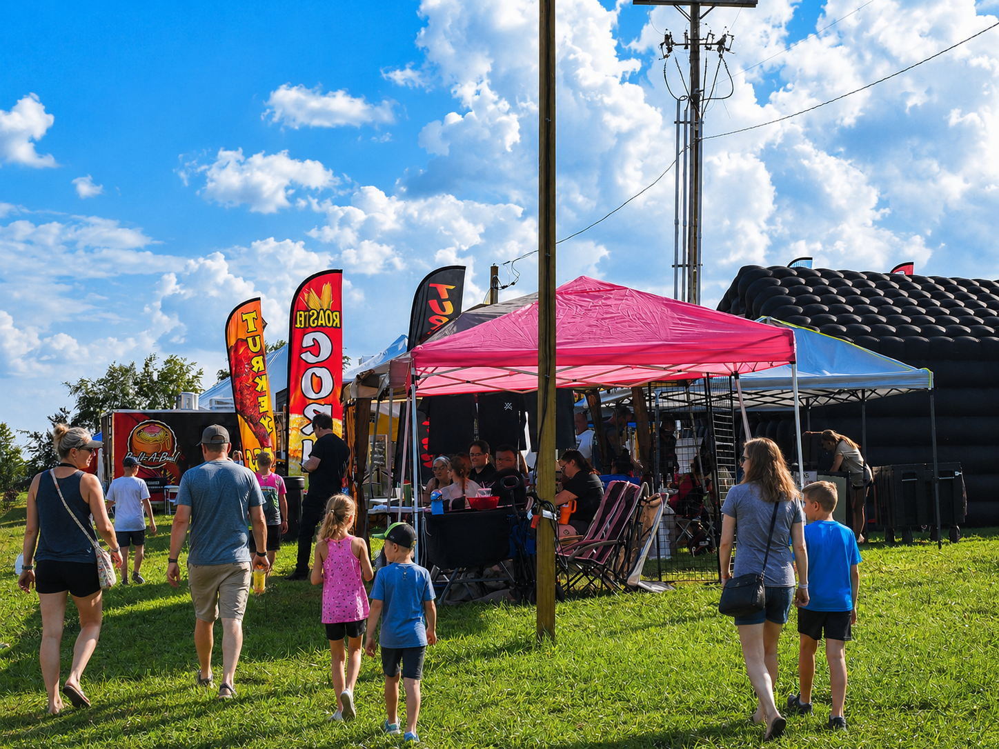 Visitors take in activities at the inaugural Sullivan County Fair in Piney Flats, Tenn., in August 2026. The Aug. 3-8 event featured rides, inflatables, games and attractions, with live entertainment each night and a nighttime drone show Thursday through Saturday. [Photo: S Cobaugh]