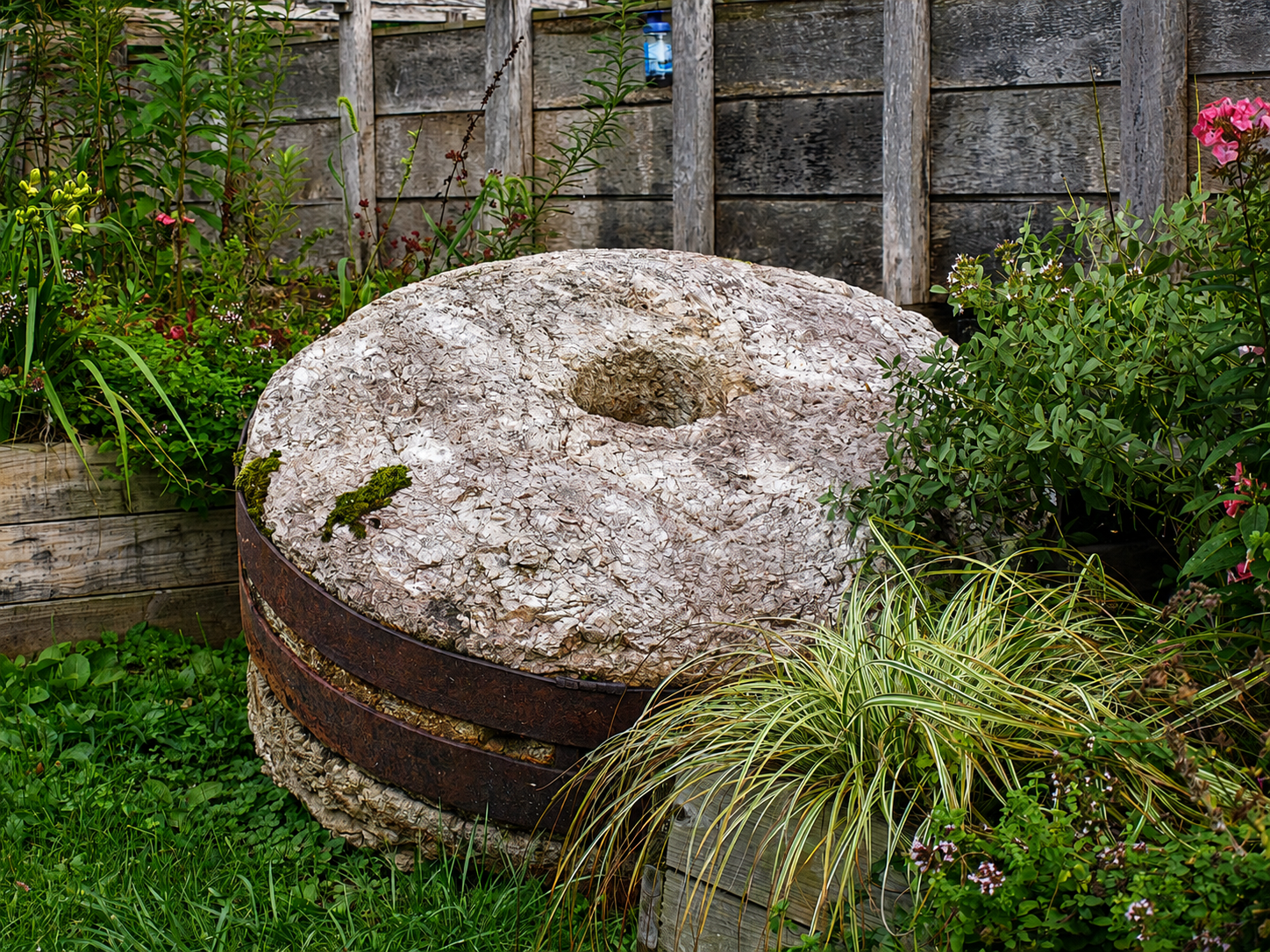 A mill stone is seen outside historic White's Mill in Abingdon, Va. According to local accounts, the mill escaped destruction during a Civil War raid in 1864 by Union cavalry. The waterwheel was damaged but a thunderstorm prevented the building from being burned. [Photo: S Cobaugh]
