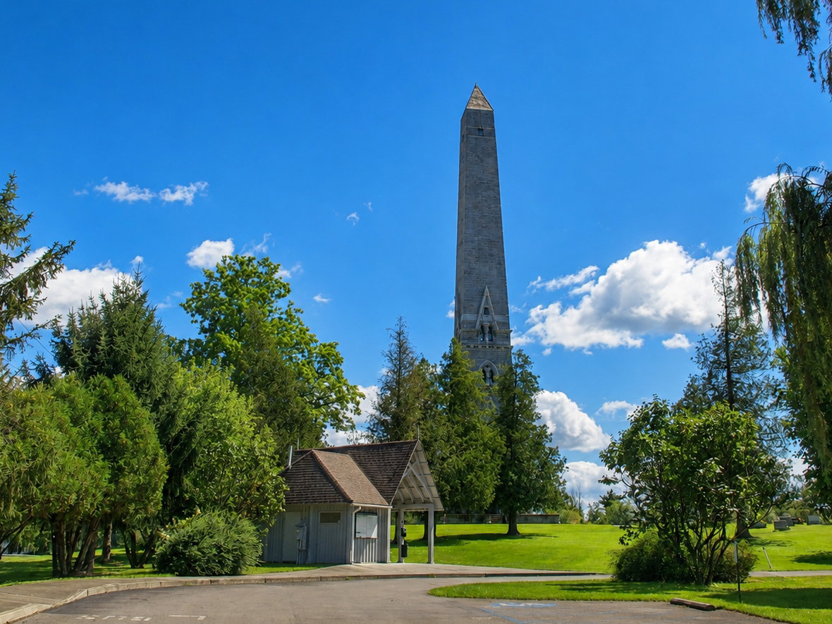 America 250: The Saratoga Monument rises above the grounds at Saratoga National Historical Park in Victory, N.Y. The 155-foot stone obelisk commemorates Burgoyne’s surrender to Gates and the American victory in the Battles of Saratoga. [Photo: S Cobaugh, Aug. 21, 2026]: