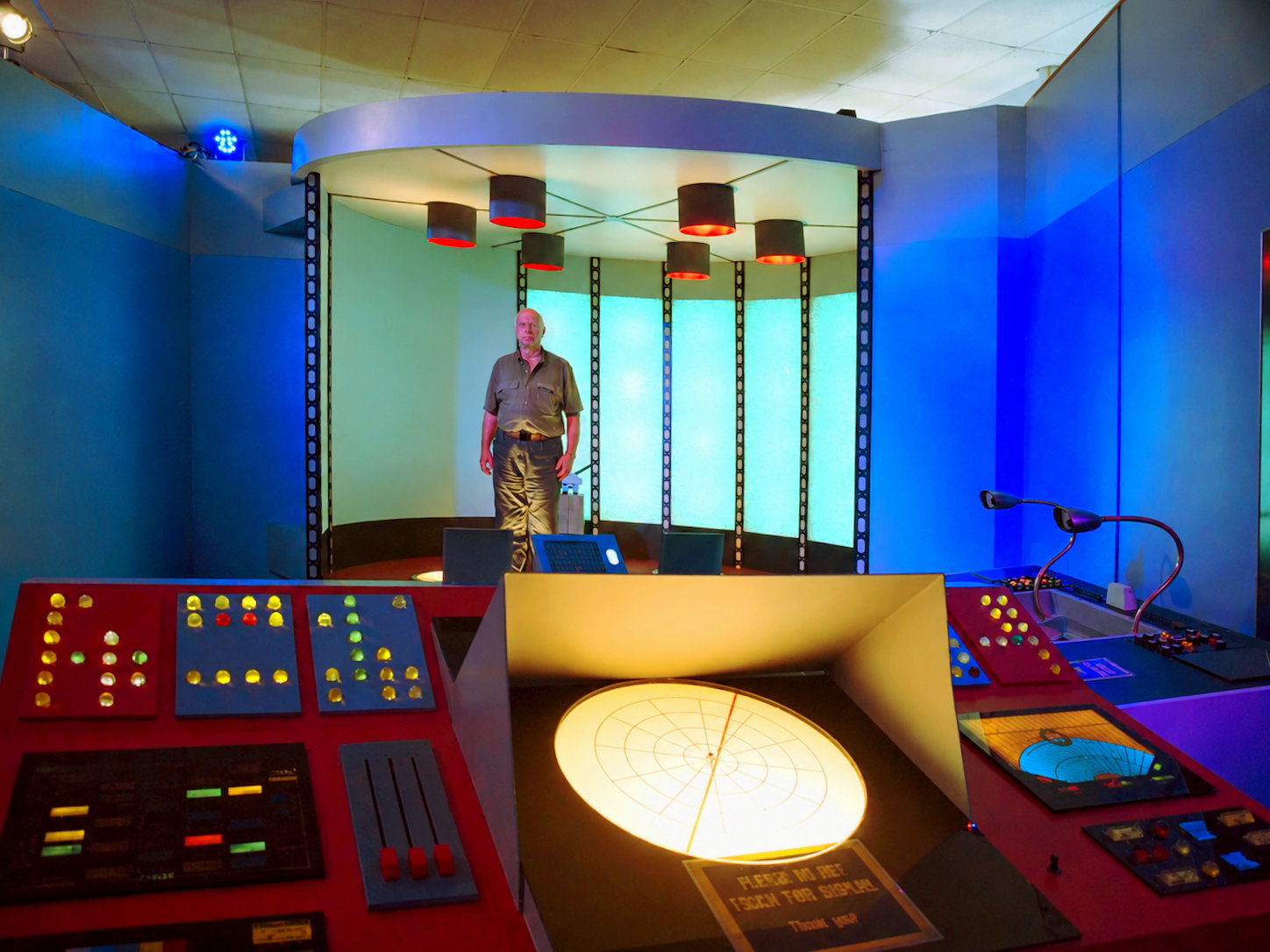 Stephen Cobaugh, Eventis Media News Director, stands on a pad in a replica Star Trek transporter room. It is one of the Enterprise interiors that make up the guided attraction in Ticonderoga, N.Y., known as Star Trek Original Series Set Tour. [Photo: D Dymond, Aug. 21, 2026]