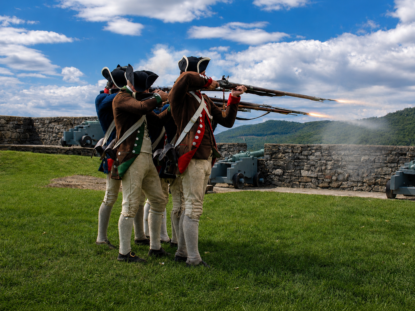 America 250: Living-history interpreters fire a volley from flintlock muskets during a demonstration at Fort Ticonderoga in Ticonderoga, N.Y. Weapons demonstrations are among the programs used by the museum to explain how Continental soldiers trained and defended the fortified position in 1776. [Photo: S Cobaugh, Aug. 22, 2026]