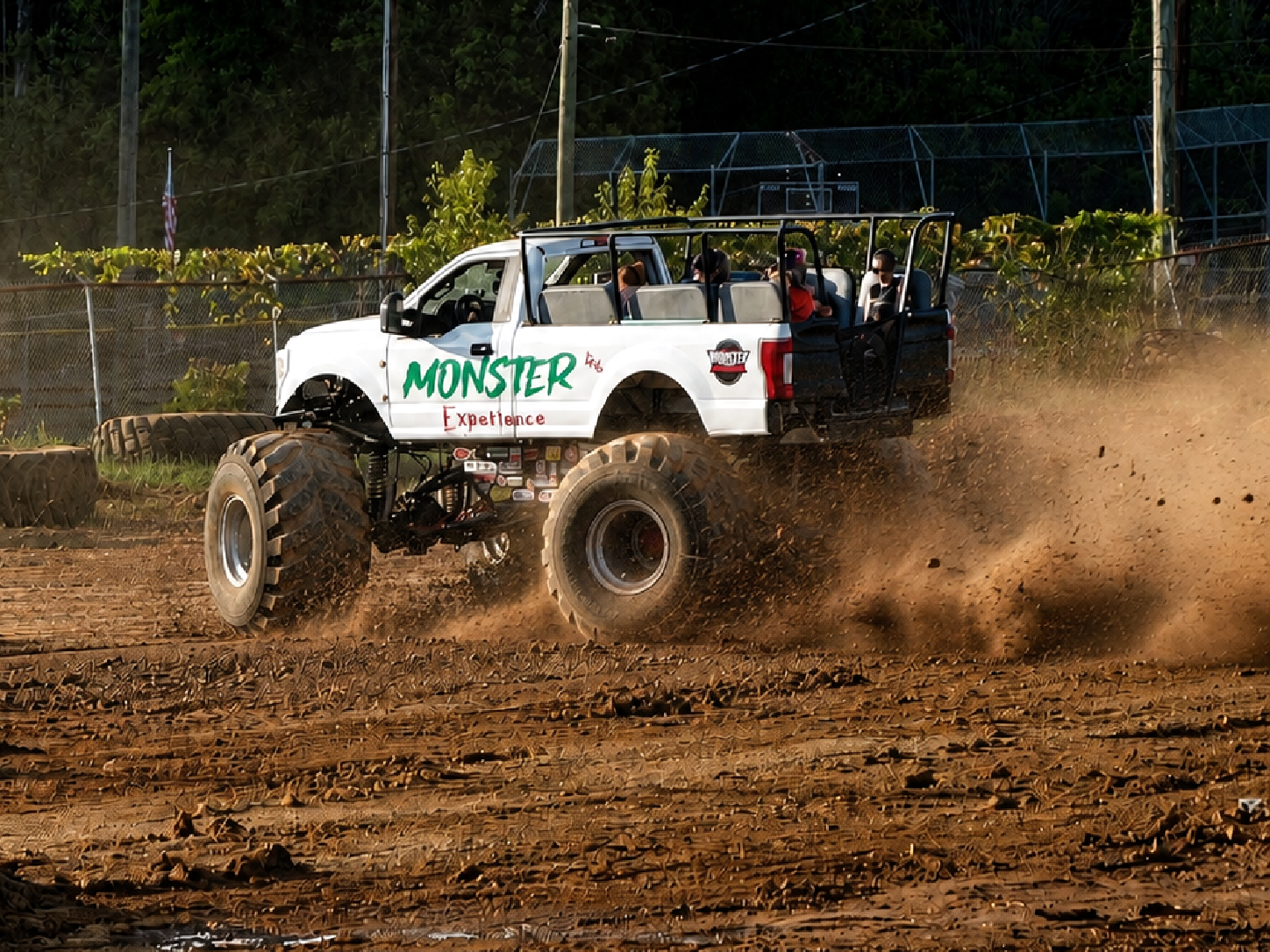 Fairgoers take a ride aboard the Monster Experience, a specially built passenger monster truck, during the 100th Appalachian Fair in Gray, Tennessee. Monster-truck attractions were among the motorsports entertainment featured during the Aug. 22-29, 2026, centennial fair, including Monster Trucks Unleashed performances in the WCYB/Appalachian Arena on Aug. 26 and 27. [Photo: J Lowry, Aug. 27, 2026]