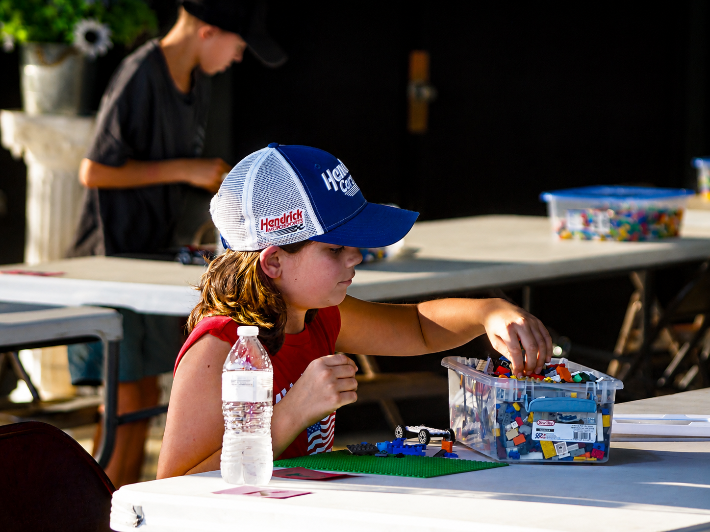A youngster participates in a LEGO building competition at the 2026 Appalachian Fair, held in Gray, Tenn. Children in differing age groups were given 30 minutes to create something using LEGO bricks, with judging being based on originality, color and design. [Photo: S Cobaugh, Aug. 27, 2026]