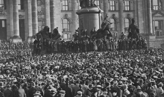 Explain why the Weimar Republic was unpopular in the years 1919-23. Ensure you make reference to the Treaty of Versailles and the new constitution.