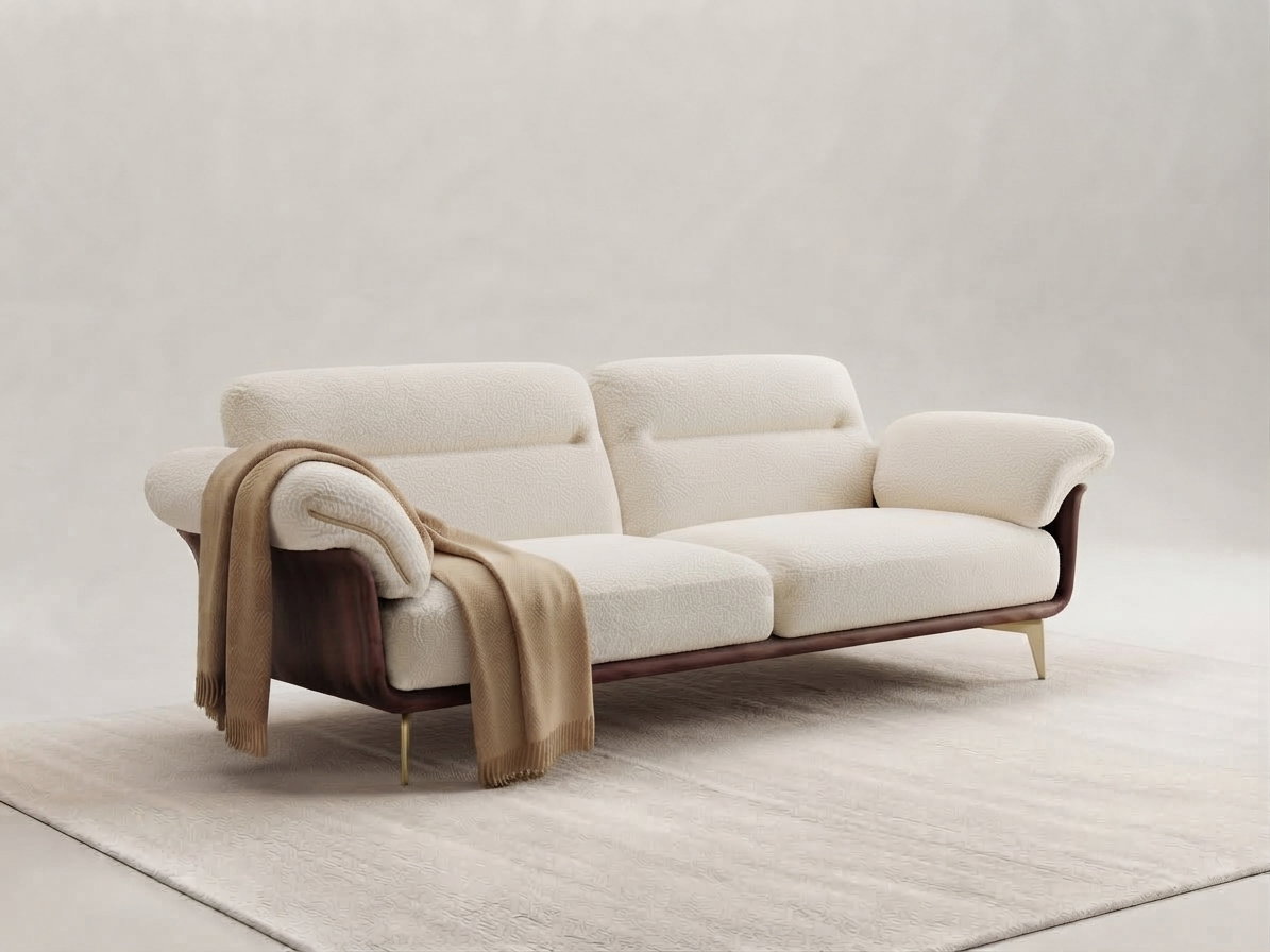Custom restaurant sofa in cream boucle with dark wood base and brass legs