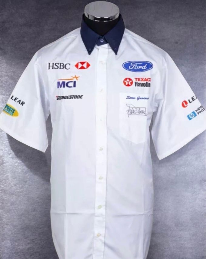 SIR JACKIE STEWART SIGNED STEWART GRAND PRIX F1 TEAM PIT CREW SHIRT 1988
