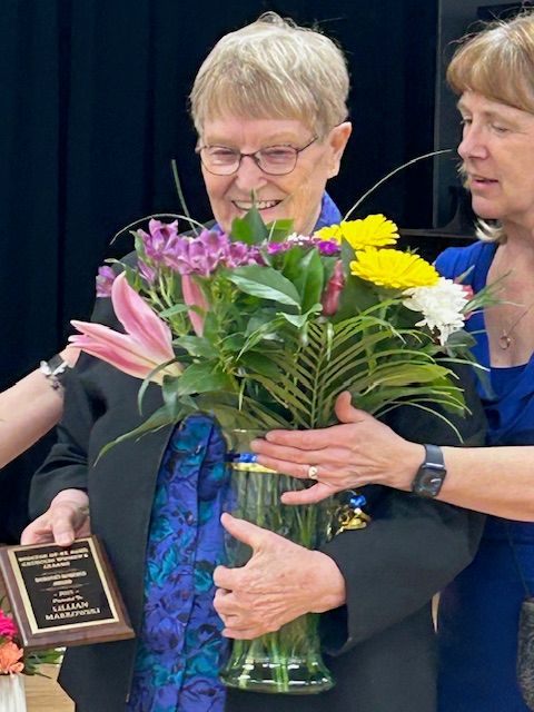Lillian Markowski receiving the Dorothy Roberts award.