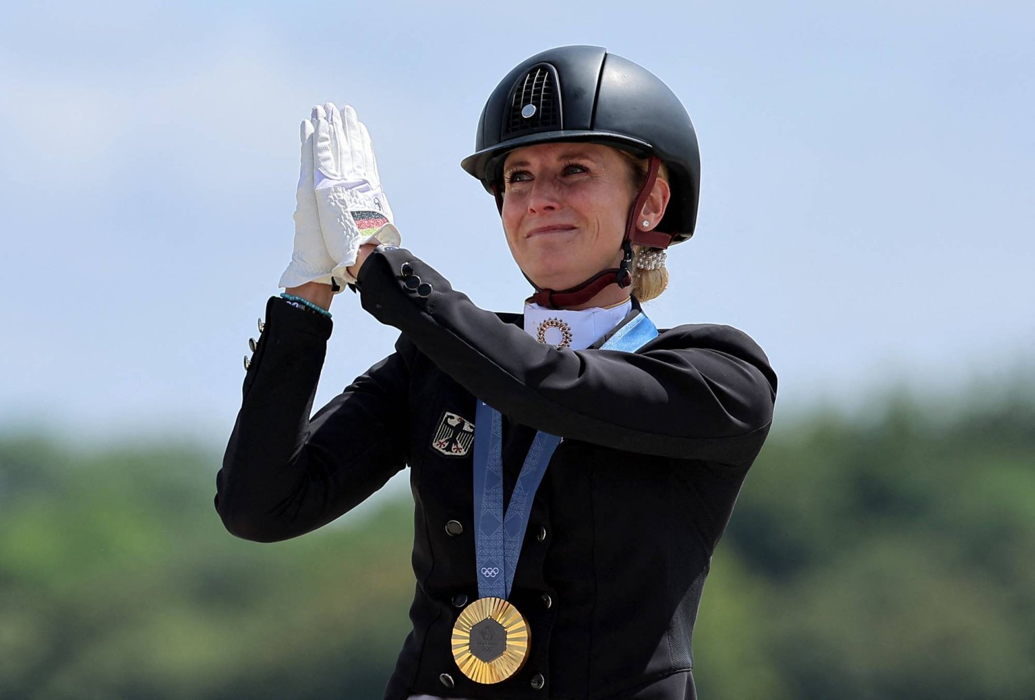 Germany's von Bredow-Werndl retains Olympic dressage title