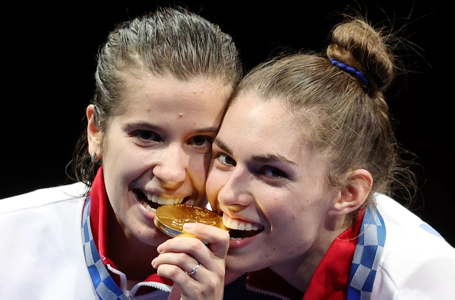 What is the secret behind athletes biting their Olympic medals?