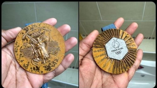 أكثر من 100 رياضي يعيدون ميدالياتهم