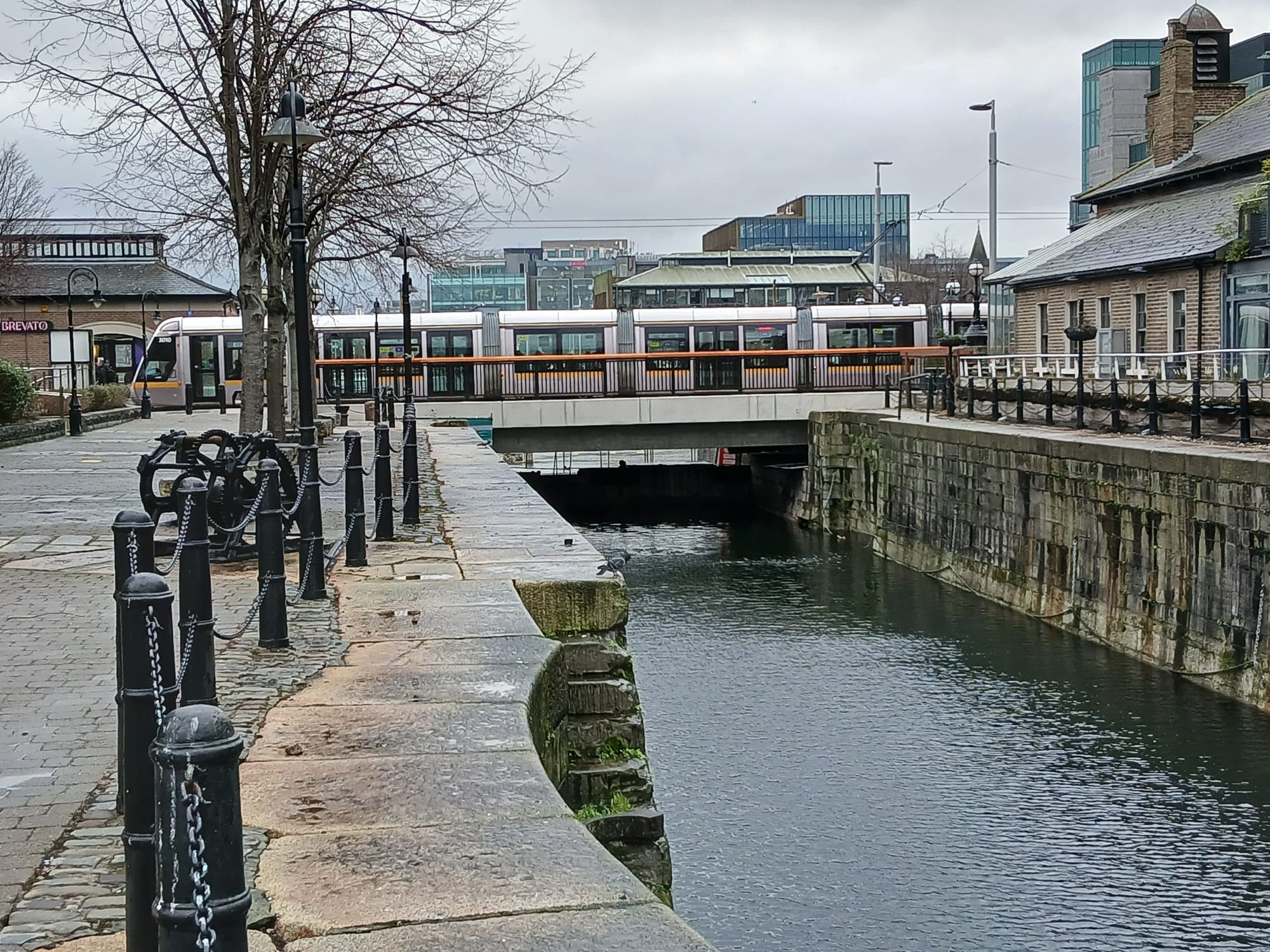 2026 01 29th River Liffey Dublin, Georges Dock LUAS crosses over lock to inner basin