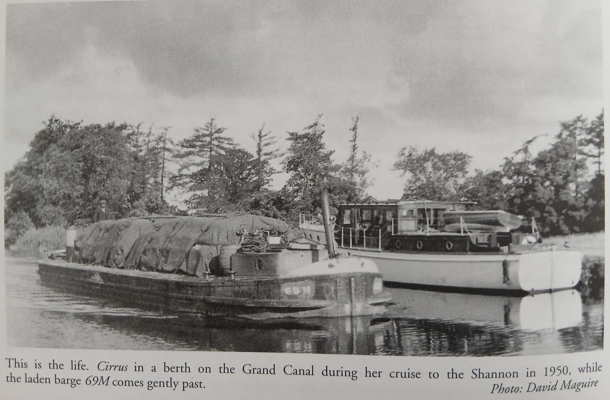 1950s wooden boat Cirrus moored with Grand Canal Company barge 69.M loaded and underway, from W.M.Nixon book Howth a Centenary of Sailing