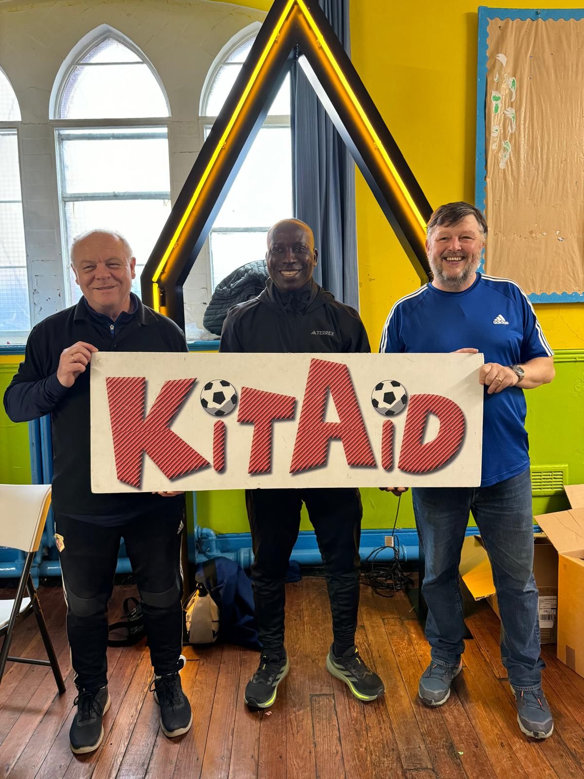 KitAid Founder - Derrick Williams, AYEM Founder - Oscar Ayang and Liverpool KitAid coordinator - Richard Gillham