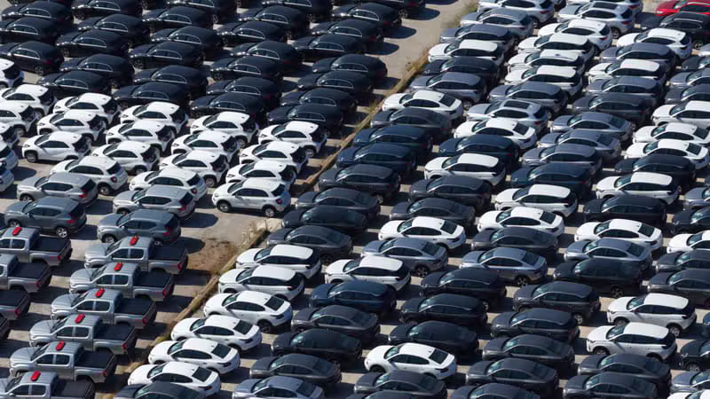 Premium rental cars parked in a city pickup area