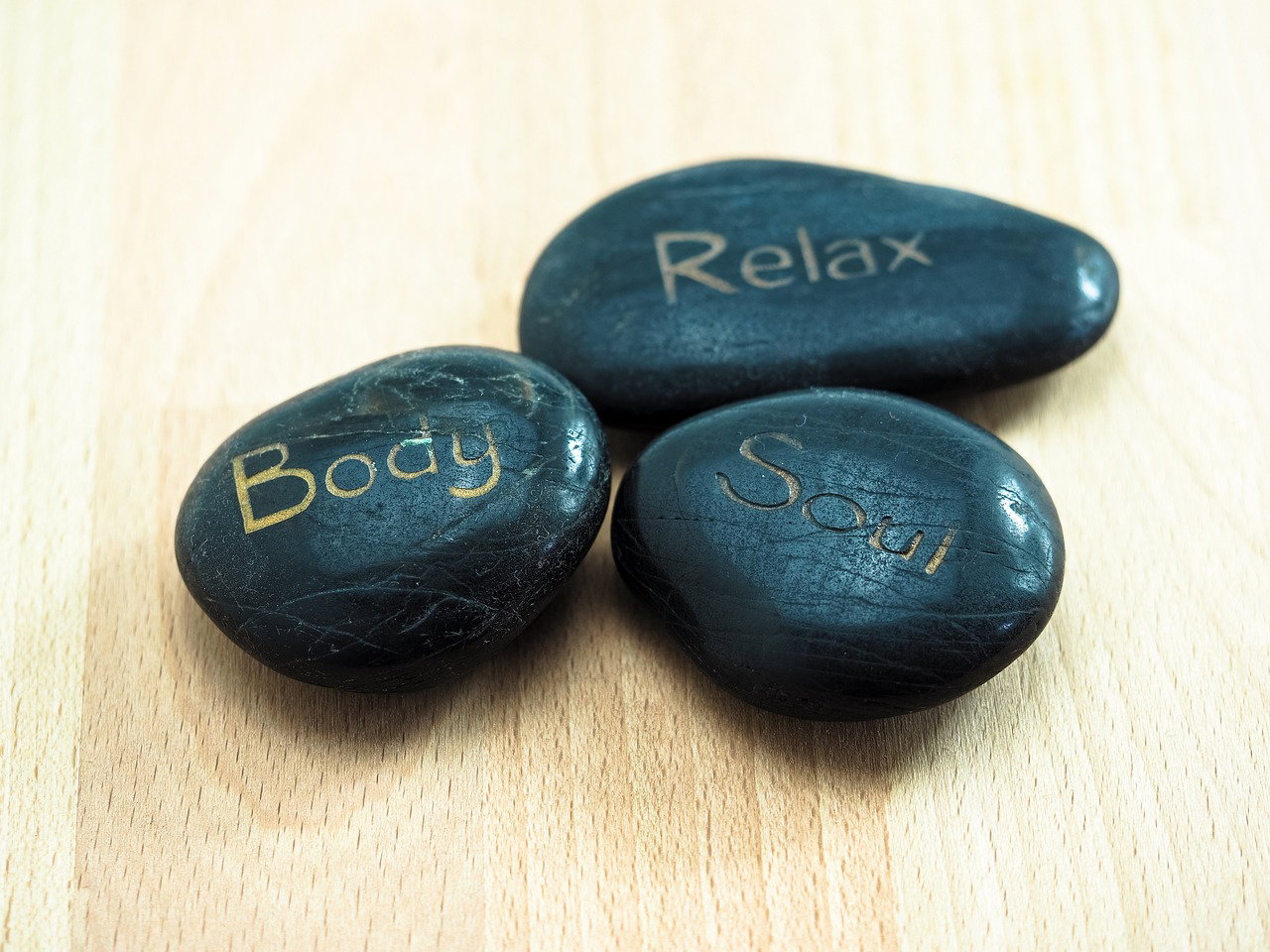 Relaxing stones with words body soul and relax