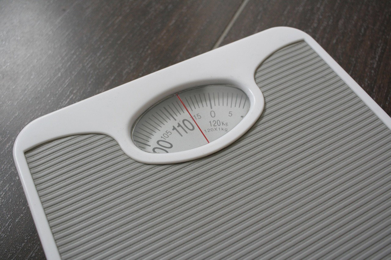 Weight scale showing high body weight and health risk