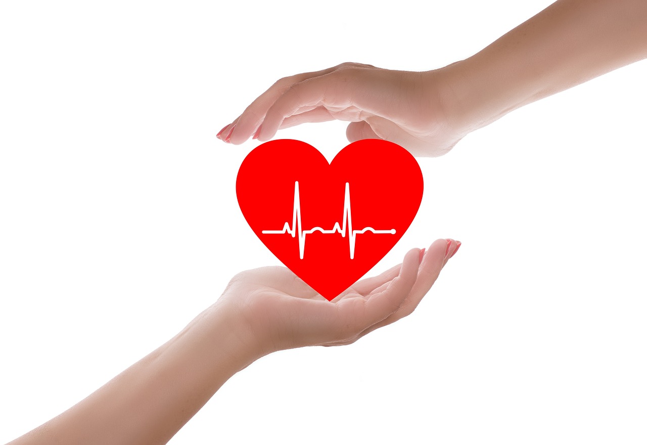 Hands holding heart symbol representing heart health support