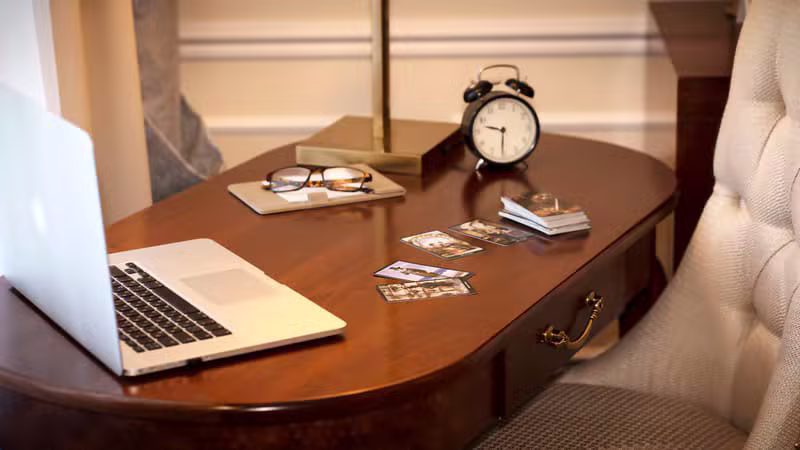 Postcards and coffee on an elegant travel writer desk