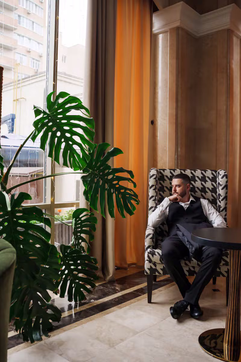 Atlas & Amber travel editor in a boutique hotel lobby