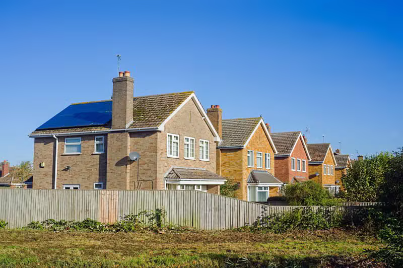 Solar panels on a sunny suburban home roof
