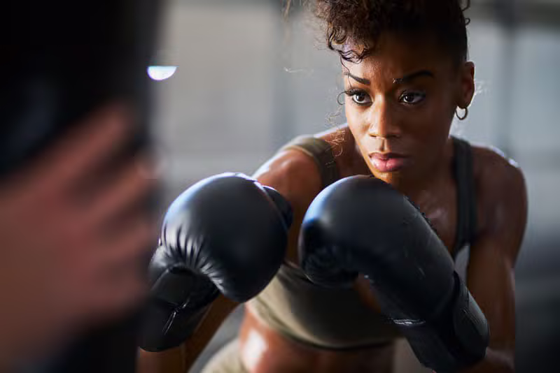 Boxer throwing combinations at the punching bag