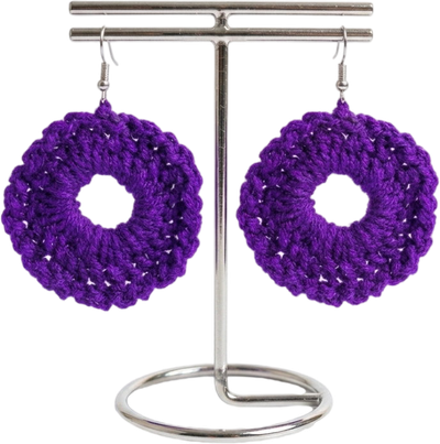 Handcrafted royal purple circular crochet halo drop earrings displayed on a silver T-bar stand against a plain white background