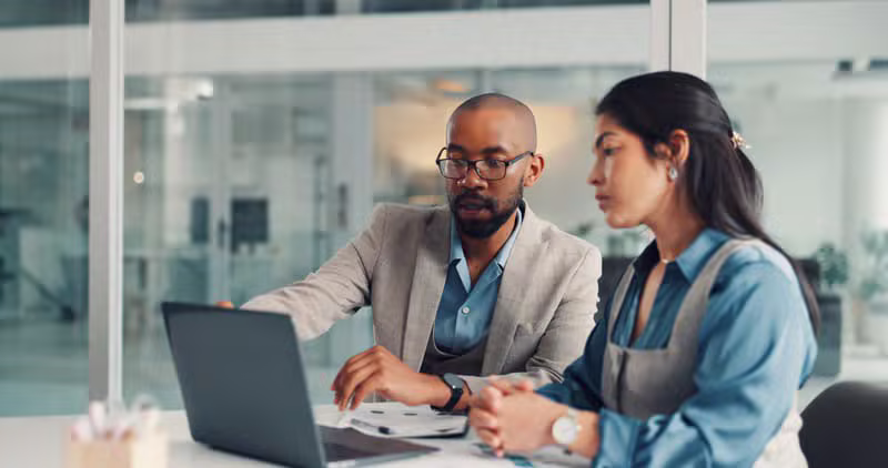 Professional accountant reviewing financial documents in a modern office