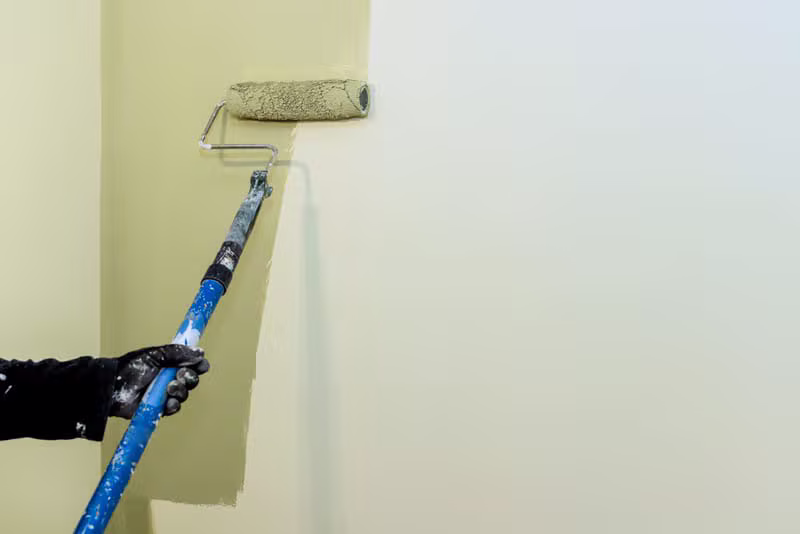 Professional painter beautifully finishing an interior living room