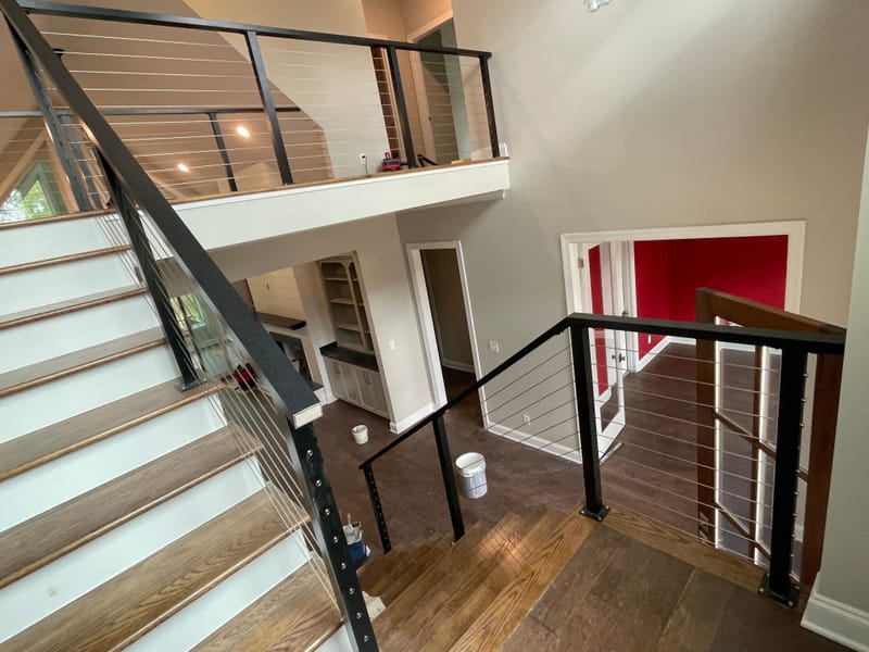 Modern aluminum deck railing installed on a suburban home