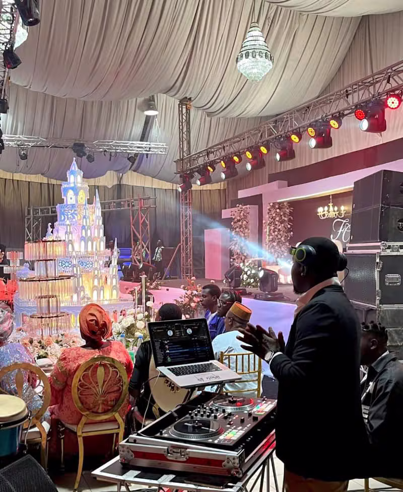 DJ Kumzy playing at an elegant indoor celebration