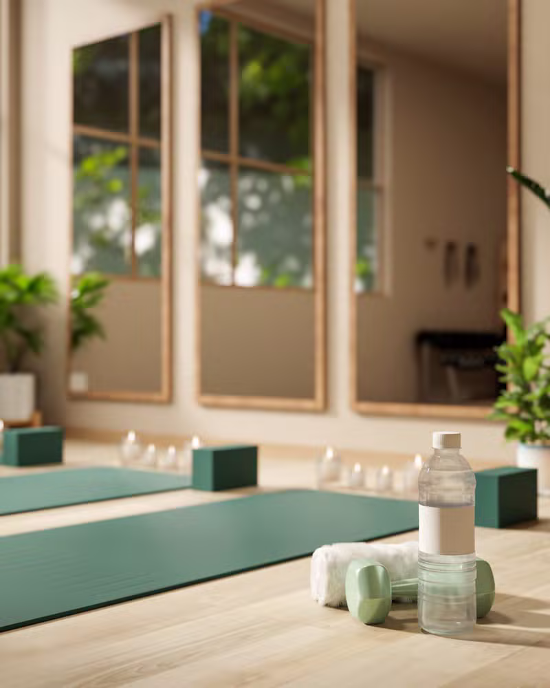 Instructor guiding a mindful yoga practice in a bright studio