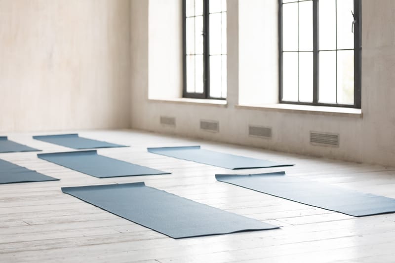 Luxury yoga studio lounge with calming minimal design