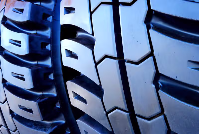 Commercial truck tyres stacked in a warehouse