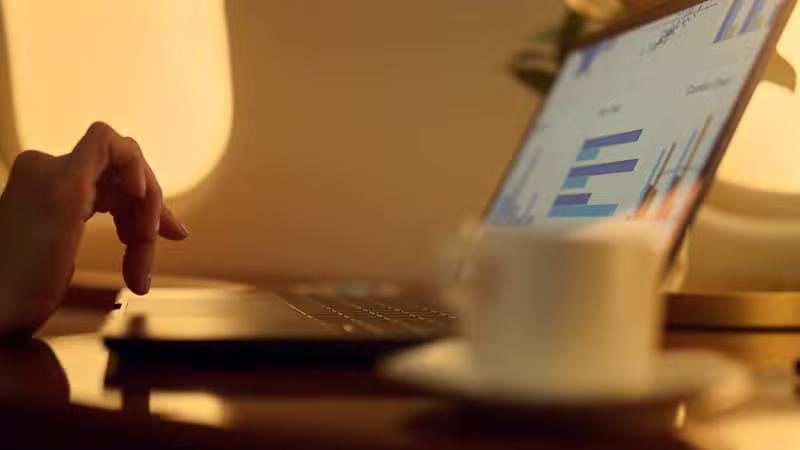 Warm desk scene with marketing analytics and books